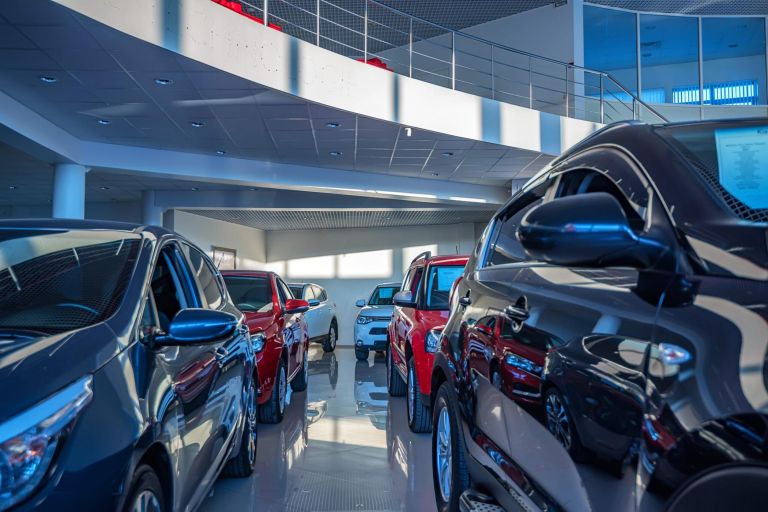 Stock of cars in showroom of automobile dealer