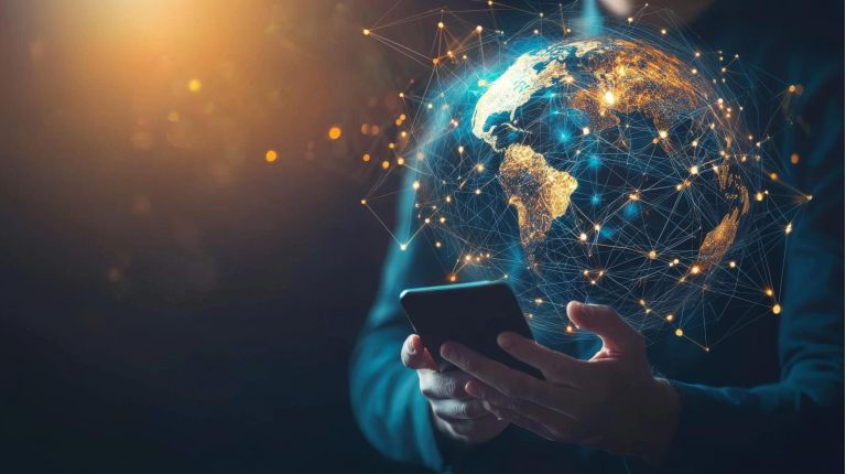 Businessman using smartphone with global digital marketing concepts, including SEO, email, social networks, mobile apps, and blue light waves on the virtual globe