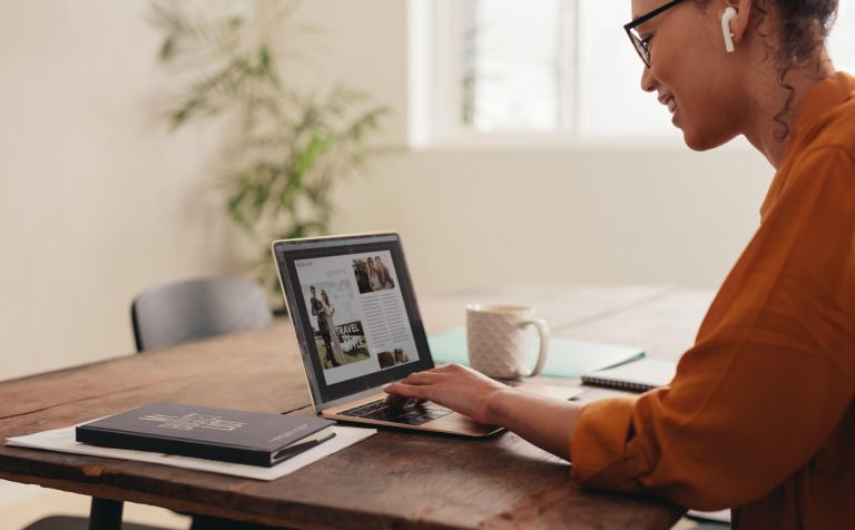 Female magazine editor working on her laptop. Businesswoman working from home on a laptop.