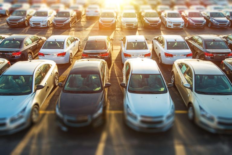 Dealer Vehicles in Stock. Brand New Cars Awaiting Clients on the Dealer Parking Lot. New Cars Section.