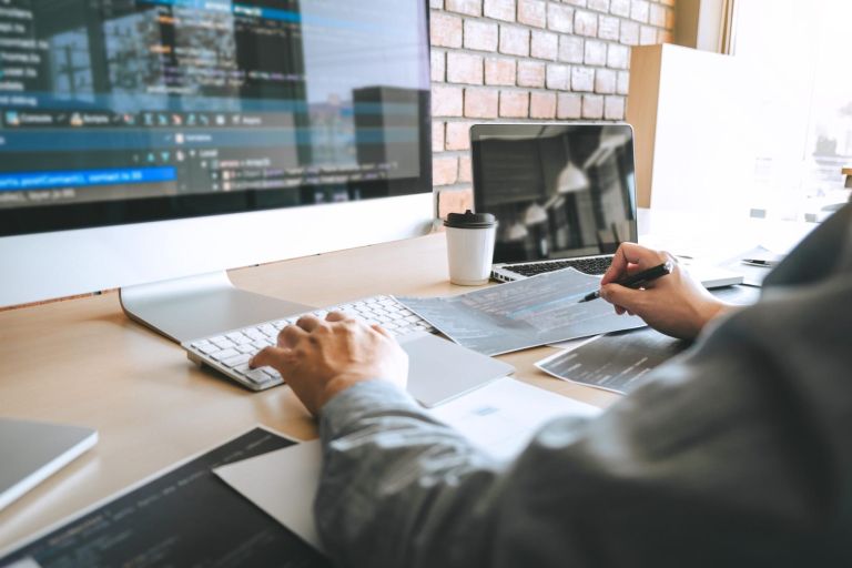 Professional Developer programmer working a software website design and coding technology, writing codes and database in company office, Global cyber connection technology.