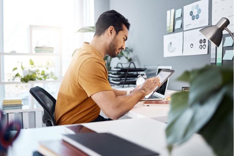 Office tablet, project focus and man typing, scroll or monitor online UI statistics, feedback data or insight analysis. Creative business agency, SEO research and person working on app design process.